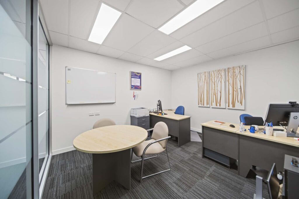 Modern office with 2 desks and table
